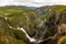 Beautiful view of the Voringsfossen waterfall. Picturesque mountain landscape with waterfalls.