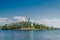 Beautiful view from the water to the island with the Orthodox Church. St. Nicholas Skete of the Valaam Monastery. Church of St.