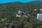 Beautiful view of white pavilion on royal route from Livadia Palace on green slopes of Crimean mountains