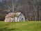 Beautiful view of a wooden cabin in a land surrounded by bare trees