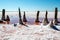 A beautiful view of wooden fence with pink salt. Pink salt lake with blue sky