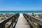 Beautiful view of a wooden path going to Henderson Beach State Park Destin in the USA