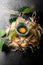 Beautiful view on yolk of egg in blue shell on wood fiber with green leaves