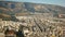 Beautiful views from the height of a bird`s flight to homes in Athens Greece, with beautiful mountains in the background