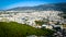 Beautiful views from the height of a bird`s flight to homes in Athens Greece, with beautiful mountains in the background