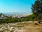 Beautiful views from the height of a bird`s flight to homes in Athens Greece, with beautiful mountains in the background