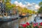 Beautiful views of the streets, ancient buildings, people, embankments of Amsterdam