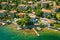 Beautiful villas near the coast of rocky beach in a small town Lovran, Croatia. Arial view of Lungomare sea walkway with