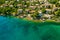 Beautiful villas near the coast of rocky beach in a small town Lovran, Croatia. Arial view of Lungomare sea walkway with