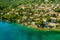 Beautiful villas near the coast of rocky beach in a small town Lovran, Croatia. Arial view of Lungomare sea walkway with