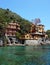 Beautiful villas on the shore of Portofino with clear green water of the Mediterranean sea, Portofino, Italy