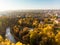 Beautiful Vilnius city panorama in autumn with orange and yellow foliage. Aerial evening view. Fall city scenery in Lithuania