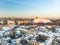 Beautiful Vilnius city panorama in winter with snow covered houses, chruches and streets. Aerial evening view