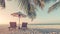 Beautiful vintage beach landscape. Tropical nature scene. Palm trees and blue sky. Summer holiday and vacation concept.