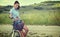 Beautiful vintage girl sitting next to bike, summer time