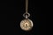 Beautiful vintage pocket watch with chain on black background. Hypnosis session