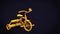Beautiful vintage yellow toy tricycle on black background