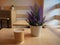 Beautiful violet lavender in a iron little bucket and a cup of coffee on the wooden table