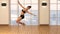 Beautiful Virtual Asian Woman taking a class of pole dance and fitness inside a studio