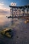 Beautiful vista of a sea shore next to a pontoon shot at sunrise or sunset