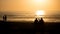 Beautiful vivid beach sunset with silhouetted people over Atlantic Ocean in Vila do Conde, Porto, Portugal