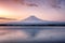 Beautiful volcano mount Fuji reflection on lake in dawn at Kawaguchiko