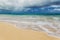 Beautiful Waimanalo beach with turquoise water and cloudy sky
