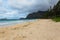 Beautiful Waimanalo beach with turquoise water and cloudy sky, Oahu
