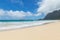 Beautiful Waimanalo beach with turquoise water and cloudy sky, Oahu coastline
