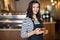 Beautiful Waitress Holding Coffee Cup In Cafeteria