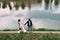 Beautiful walk young lovers bride and groom on the river bank