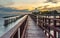 Beautiful of The walkway red wooden bridge in evening at Bang Khun Thian sea view, Bang Khun Thian, Bangkok