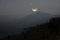 Beautiful waning moon over the mountain