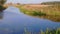 Beautiful warm autumn day view.  Gorgeous landscape with fields, on river coast.