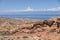 The beautiful wasteland of Skazka Canyon with Lake Issyk-Kul in the background in Kyrgyzstan