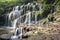 Beautiful waterfall of Banyu Wana Amertha in tropical jungle. Scenic Waterfall with Rock. Picturesque waterfall cascade in Bali.