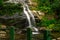 Beautiful waterfall called `Cascatinha Taunayon` on green nature in the Atlantic Rainforest, Tijuca Forest National Park