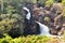 Beautiful Waterfall Cascading Down in a Tropical Surrounding