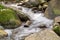 Beautiful waterfall deep in the forest. cool and clean water falling in the stone. concept nature and travel