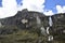 A beautiful waterfall falls from a high mountain, on the way to Lagoon 69. Huascaran National Park in the Sands of Peru