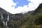 A beautiful waterfall falls from a high mountain, on the way to Lagoon 69. Huascaran National Park in the Sands of Peru