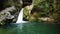 Beautiful waterfall in green wild forest top aerial view. Tropical in mountain jungle. Waterfall close up 4k. Panoramic