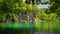 Beautiful waterfall illuminated by sunlight in Plitvice Lakes