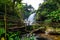 beautiful waterfall in northern Thailand, name Pha dok siew waterfall in Doi intanon national park with bamboo bridge