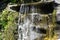 Beautiful waterfall outside Batu Caves temple in Malaysia, Waterfall outside hindu religion temple Batu caves