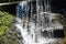 Beautiful waterfall outside Batu Caves temple in Malaysia, Waterfall outside hindu religion temple Batu caves