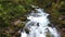 Beautiful waterfall river with lots of fresh water in the mountains in Austria