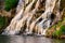 Beautiful waterfall at sunset in the rays of the setting sun II