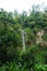 Beautiful waterfall in tropical rainforest, Indonesia waterfall in Cimahi. Green background walpaper