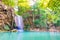 Beautiful waterfall in wild rainforest in Erawan National park, Thailand